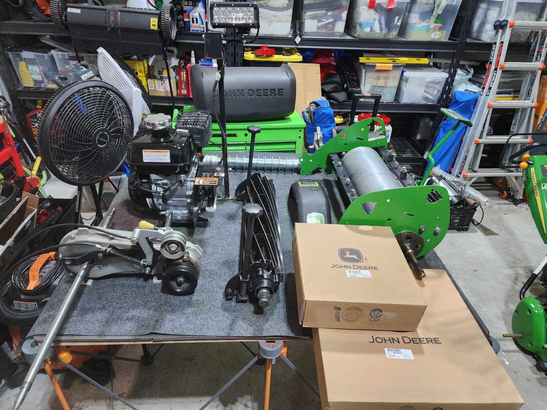 A complete reel mower teardown arranged on the Low Mow workbench